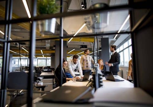 Group of young business people are working together on a laptop